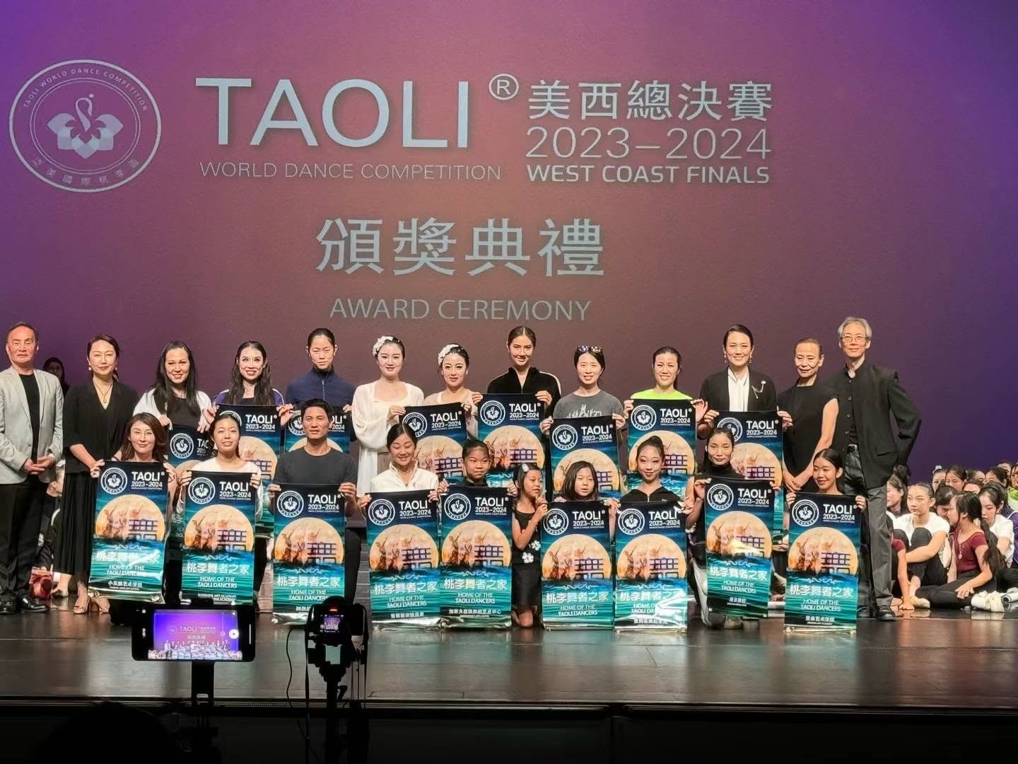 H&L Dance receiving Home of the Taoli Dancers recognition at the 2024 West Coast Finals